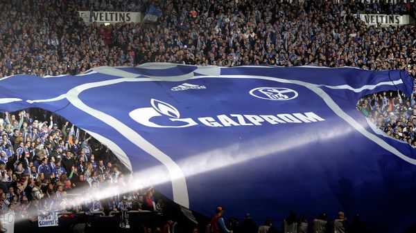 FILE - Soccer club FC Schalke 04 supporters unfold a giant team's jersey with the logo of Russian sponsor Gazprom, at the Veltins-Arena in Gelsenkirchen, Germany, on Jan. 20, 2007 - Sputnik International
