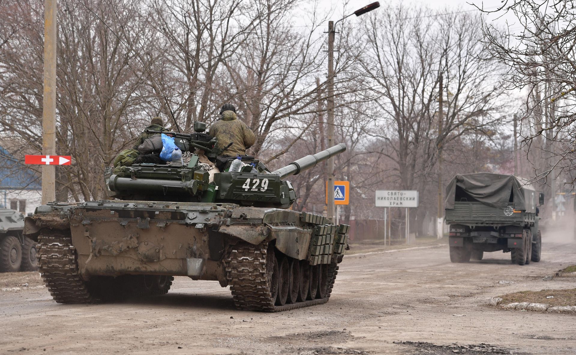 Servicemen from the Donetsk People's Republic militia are pictured on a military vehicle in the village of Nikolaevka, Donetsk region, DPR. - Sputnik International, 1920, 11.03.2022