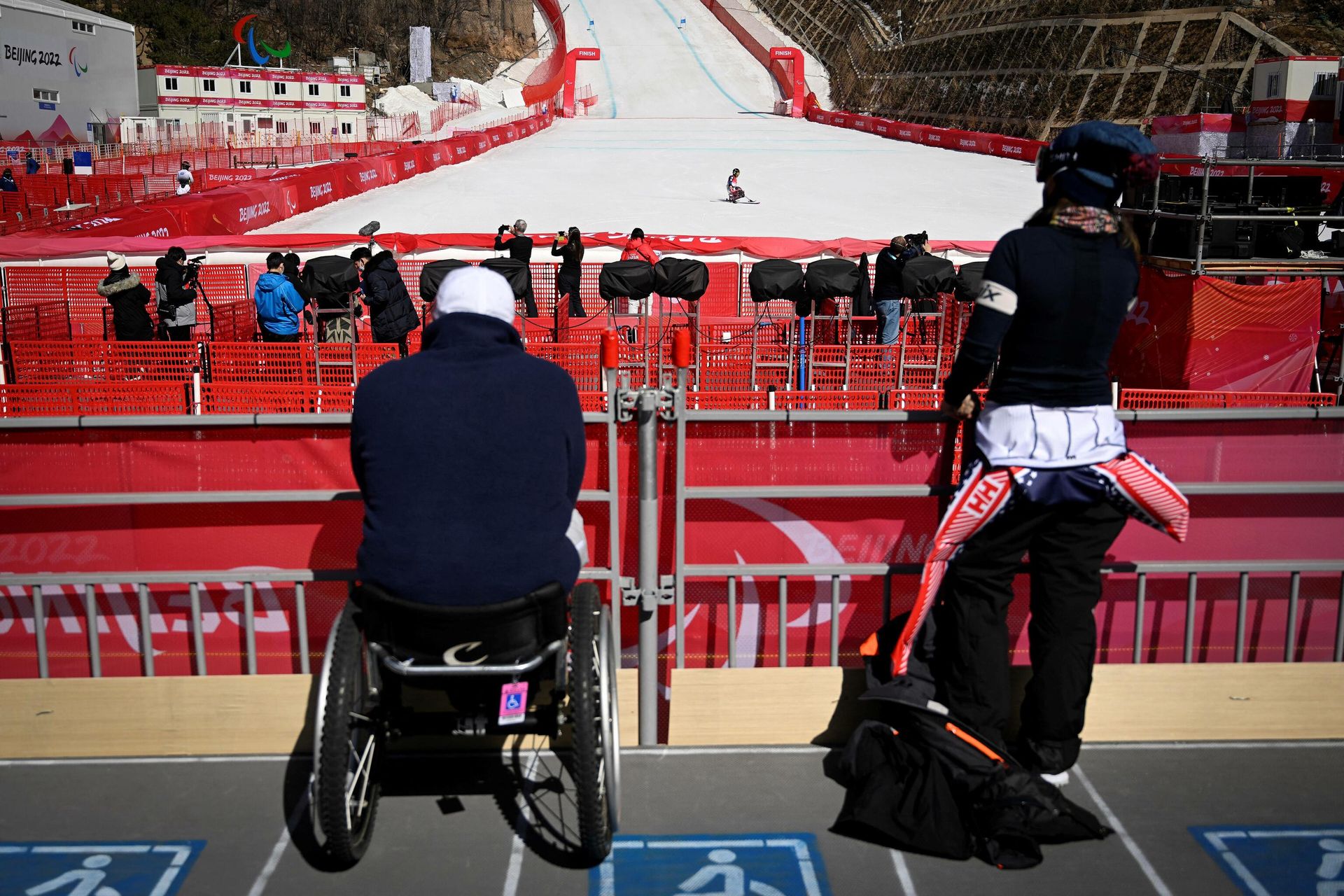 A paralympic athlete crosses the finish line during a training session for the men's downhill sitting event at the Yanqing National Alpine Skiing Centre in Yanqing ahead of the Beijing 2022 Winter Paralympic Games on March 3, 2022. A paralympic athlete crosses the finish line during a training session for the men's downhill sitting event at the Yanqing National Alpine Skiing Centre in Yanqing ahead of the Beijing 2022 Winter Paralympic Games on March 3, 2022. - Sputnik International, 1920, 04.03.2022