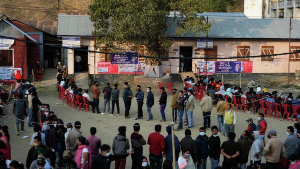 Voters wait outside a polling booth during the first phase of Manipur state elections in Imphal, India, Monday, Feb. 28, 2022 - Sputnik International
