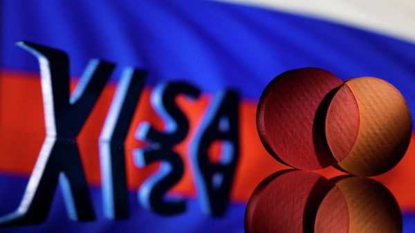 Visa and Mastercard logos are seen in front of Russian flag in this illustration taken March 1, 2022.  - Sputnik International
