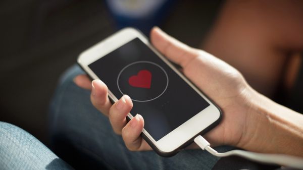 Close up of hands charging mobile phone - Sputnik International