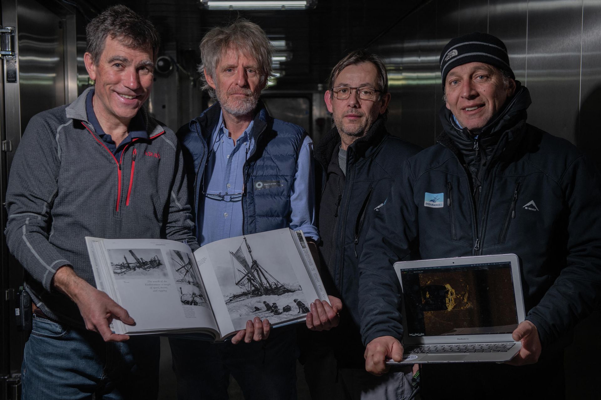 This handout picture taken in Antarctica's Weddell sea on March 5, 2022, and released by the Falklands Maritime Heritage Trust shows (From L) John Shears, Endurance22 Expedition Leader, Mensun Bound, Director of Exploration, Nico Vincent, Expedition Sub-Sea Manager, JC Caillens, Off-Shore Manager with the first scan of the wreck and photos of Frank Hurley. - One of the world's most storied shipwrecks, Ernest Shackleton's Endurance, has been discovered off the coast of Antarctica more than a century after its sinking, explorers announced on March 9. Endurance was discovered at a depth of 3,008 metres (9,869 feet) in the Weddell Sea, about four miles from where it was slowly crushed by pack ice in 1915 This handout picture taken in Antarctica's Weddell sea on March 5, 2022, and released by the Falklands Maritime Heritage Trust shows (From L) John Shears, Endurance22 Expedition Leader, Mensun Bound, Director of Exploration, Nico Vincent, Expedition Sub-Sea Manager, JC Caillens, Off-Shore Manager with the first scan of the wreck and photos of Frank Hurley. - One of the world's most storied shipwrecks, Ernest Shackleton's Endurance, has been discovered off the coast of Antarctica more than a century after its sinking, explorers announced on March 9. Endurance was discovered at a depth of 3,008 metres (9,869 feet) in the Weddell Sea, about four miles from where it was slowly crushed by pack ice in 1915 - Sputnik International, 1920, 09.03.2022