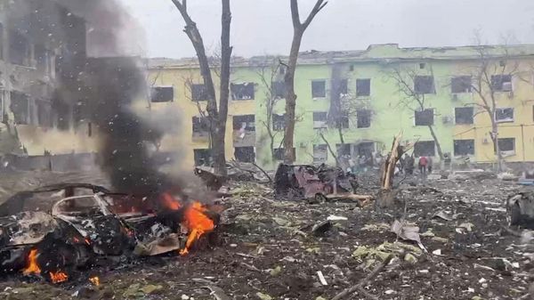 A view shows cars and a building of a hospital destroyed by an aviation strike in Mariupol, Ukraine, in this handout picture released March 9, 2022 - Sputnik International