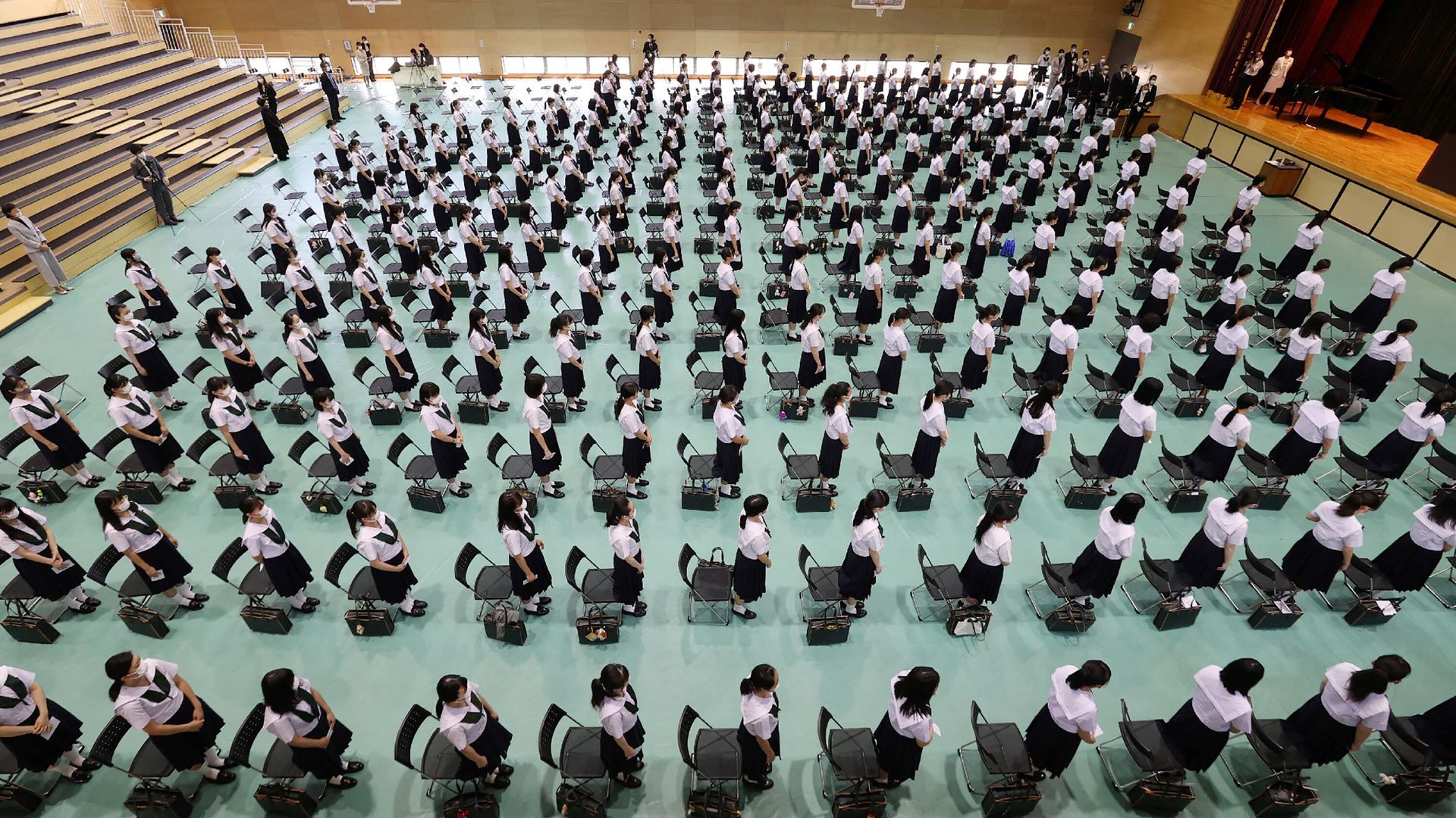 High school students wearing face masks amid concerns over the spread of the COVID-19 coronavirus attend a ceremony for the reopening of the school in Higashiosaka, Osaka prefecture High school students wearing face masks amid concerns over the spread of the COVID-19 coronavirus attend a ceremony for the reopening of the school in Higashiosaka, Osaka prefecture - Sputnik International, 1920, 11.03.2022
