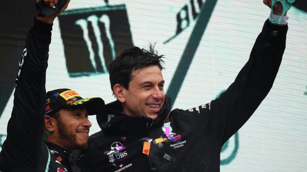 Mercedes driver Lewis Hamilton of Britain, left, celebrates with Mercedes team principal Toto Wolff on the podium after winning the Turkish Formula One Grand Prix at the Istanbul Park circuit racetrack in Istanbul, Sunday, Nov. 15, 2020. - Sputnik International