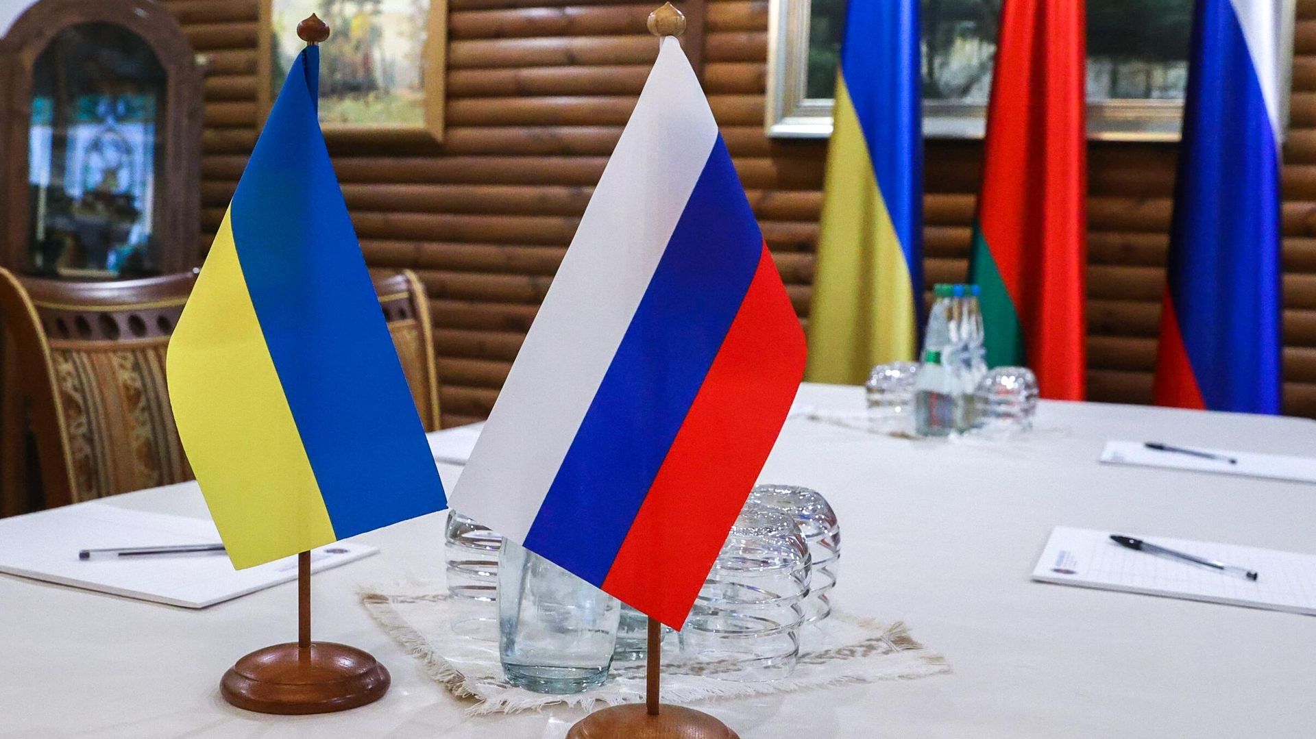 In this handout photo released by BelTA, flags are seen on a table before Russian-Ukrainian talks, in Belarus In this handout photo released by BelTA, flags are seen on a table before Russian-Ukrainian talks, in Belarus - Sputnik International, 1920, 14.03.2022