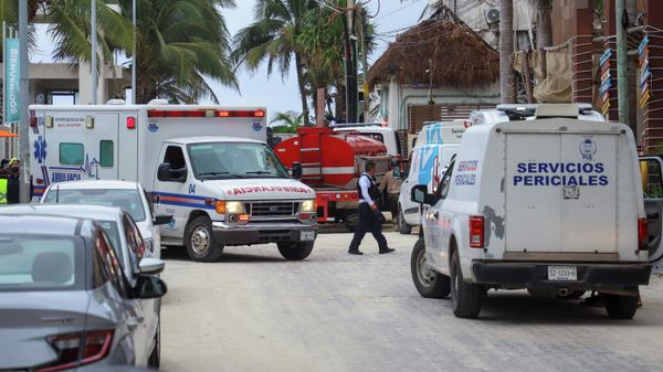 A police officer walks past an ambulance and the coroner's vehicle at a scene where an explosion occurred at the Kool Beach restaurant, presumably caused by gas accumulation, which left four tourists injured, according to local media, in Playa del Carmen, Mexico - Sputnik International