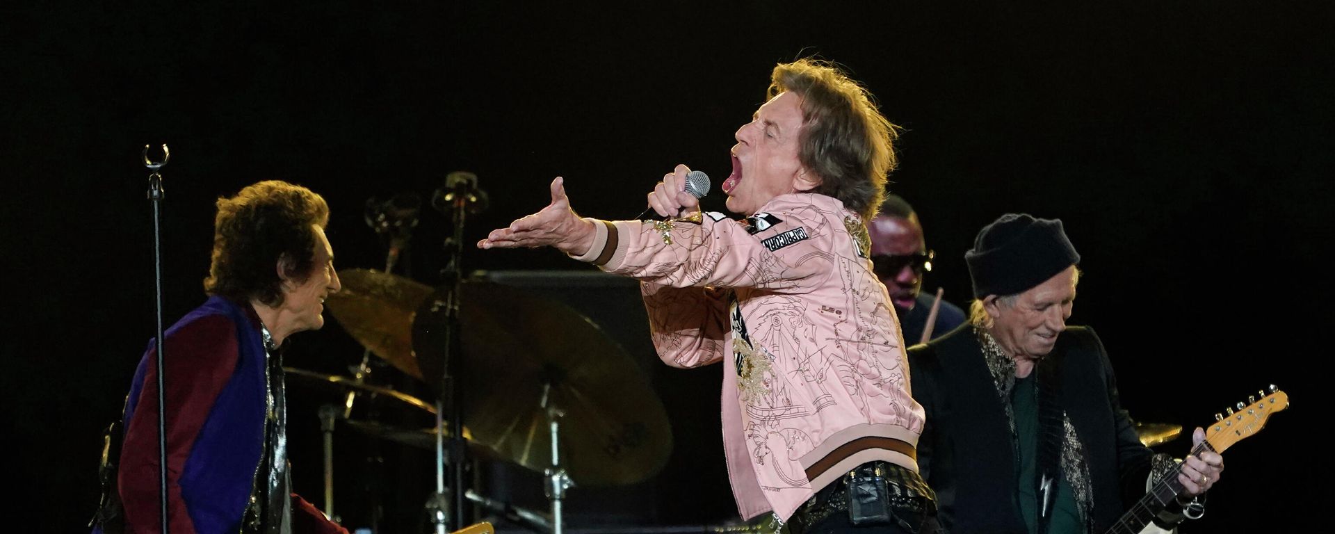 Mick Jagger, center, of the Rolling Stones performs alongside bandmates Ron Wood, left, and Keith Richards, far right, Thursday, Oct. 14, 2021, at SoFi Stadium in Inglewood, Calif.  - Sputnik International, 1920, 14.03.2022
