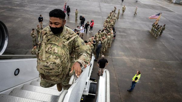 Soldiers with the U.S. Army's 87th Division Sustainment Support Battalion, 3rd Division Sustainment Brigade, board a chartered plane during their deployment to Europe, Friday, March 11, 2022, at Hunter Army Airfield in Savannah, Ga.  - Sputnik International