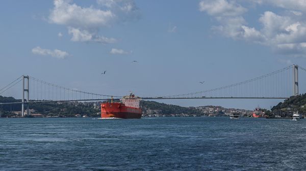 A commercial vessel sails under the 15 July Martyrs Bridge, aka the Bosphorus Bridge, on the Bosphorus strait on July 23, 2021 in Istanbul.  - Sputnik International