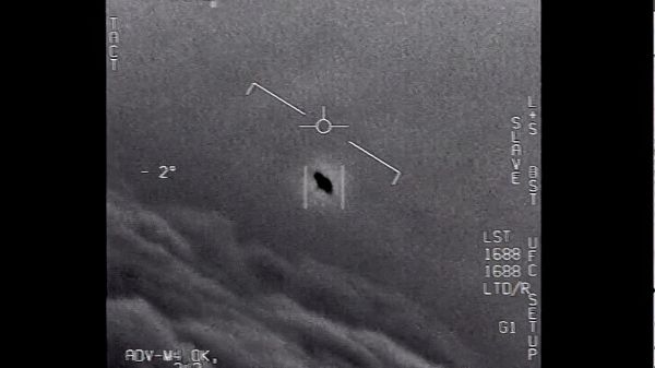 The image from video provided by the Department of Defense labelled Gimbal, from 2015, an unexplained object is seen at center as it is tracked as it soars high along the clouds, traveling against the wind.  - Sputnik International