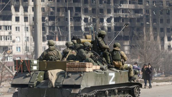 Service members of pro-Russian troops are seen atop of an armoured vehicle with the symbol Z painted on its side in the course of Ukraine-Russia conflict in the besieged southern port city of Mariupol, Ukraine March 24, 2022. - Sputnik International