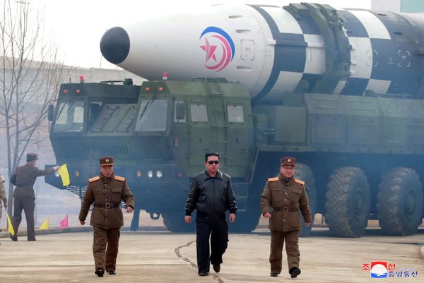 North Korean leader Kim Jong-un walks away from what state media says is a "new type" of Intercontinental Ballistic Missile (ICBM) in this undated photo released on 24 March 2022 by North Korea's Korean Central News Agency (KCNA). - Sputnik International