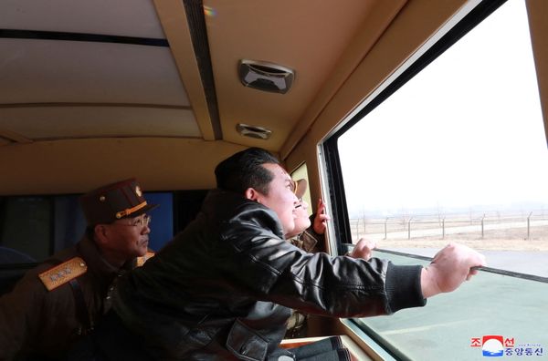North Korean leader Kim Jong-un looks through a window during the test firing of what state media report is a "new type" of Intercontinental Ballistic Missile (ICBM) in this undated photo released on 24 March 2022 by North Korea's Korean Central News Agency (KCNA). - Sputnik International