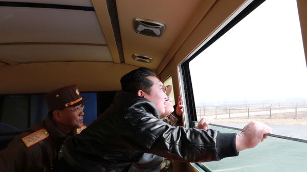 North Korean leader Kim Jong Un looks through a window during the test firing of what state media report is a new type of intercontinental ballistic missile (ICBM) in this undated photo released on March 24, 2022 by North Korea's Korean Central News Agency (KCNA). - Sputnik International
