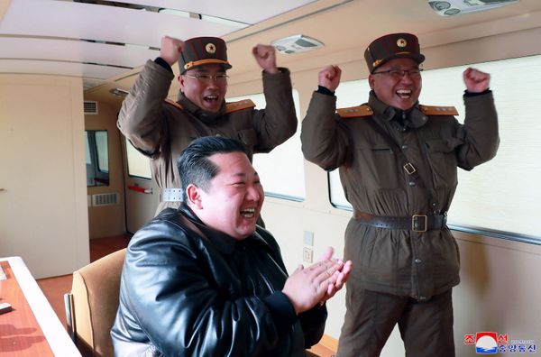 This picture taken on 24 March 2022 and released by North Korea's official Korean Central News Agency (KCNA) on 25 March 2022 shows North Korean leader Kim Jong-un (C) giving a jubilant reaction during the test launch of a new type of Intercontinental Ballistic Missile (ICBM), Hwasong-17 of North Korea's strategic forces before its test launch in an undisclosed location in North Korea. - Sputnik International