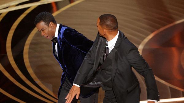 Will Smith (R) hits Chris Rock as Rock spoke on stage during the 94th Academy Awards in Hollywood, Los Angeles, California, U.S., March 27, 2022. - Sputnik International