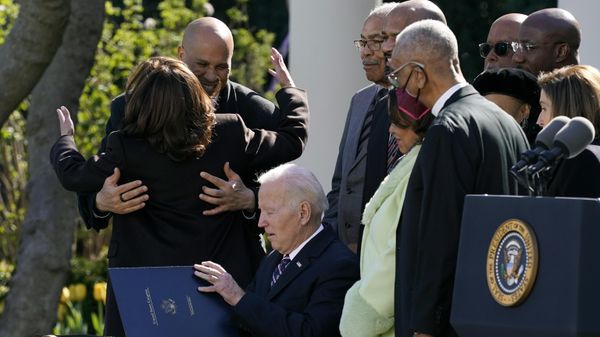 Vice President Kamala Harris hugs Sen. Cory Booker, D-N.J., after President Joe Biden signed the Emmett Till Anti-Lynching Act in the Rose Garden of the White House, Tuesday, March 29, 2022, in Washington. - Sputnik International