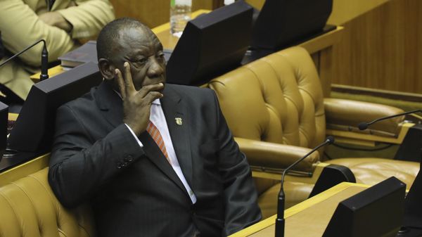 South African President Cyril Ramaphosa waits as members of the Economic Freedom Fighters (EFF) party disrupt parliament proceedings at the State of the Nation Address in Cape Town, South Africa, Thursday, Feb. 13, 2020. - Sputnik International