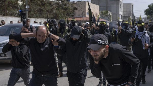 Palestinian gunmen shoot in the air during the funerals for Sanad Abu Atiyeh, 17 and Yazid al-Saadi, 23, in the West Bank refugee camp of Jenin, Jenin, Thursday, March 31, 2022. - Sputnik International