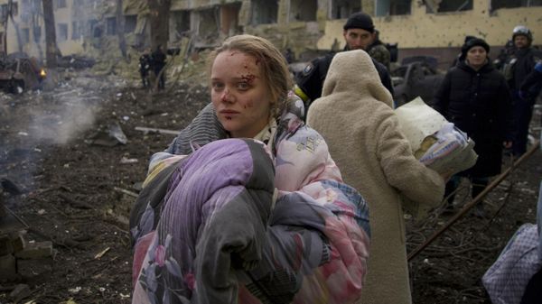 FILE - Mariana Vishegirskaya stands outside a maternity hospital that was damaged by shelling in Mariupol, Ukraine, Wednesday, March 9, 2022. Visheirskaya was taken to another nearby hospital where she gave birth the following day to a baby girl she named Veronika. “We were lying in wards when glass, frames, windows and walls flew apart,” she told AP, lying next to her newborn. We don’t know how it happened. We were in our wards and some had time to cover themselves. Some didn’t.” (AP Photo/Mstyslav Chernov, File) - Sputnik International