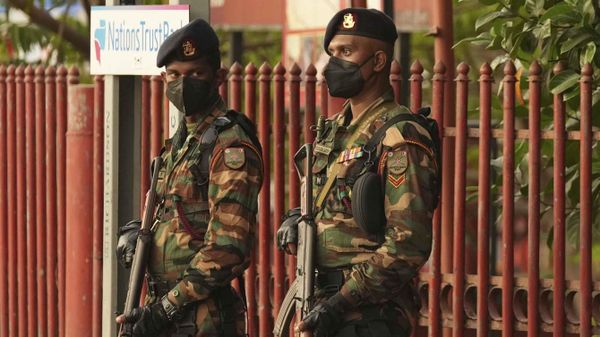 Sri Lankan army soldiers stand guard before curfew begins in Colombo, Sri Lanka, Saturday, April 2, 2022. Sri Lanka imposed a countrywide curfew starting Saturday evening until Monday morning, in addition to a state of emergency declared by the president, in an attempt to prevent more unrest after protesters took to the streets blaming the government for the worsening economic crisis.  - Sputnik International