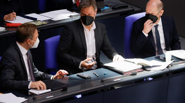 German Chancellor Olaf Scholz, Economy Minister Robert Habeck, and Finance Minister Christian Lindner chat during a budget session of Germany's lower house of parliament, the Bundestag, in Berlin, Germany, March 23, 2022. REUTERS/Michele Tantussi - Sputnik International