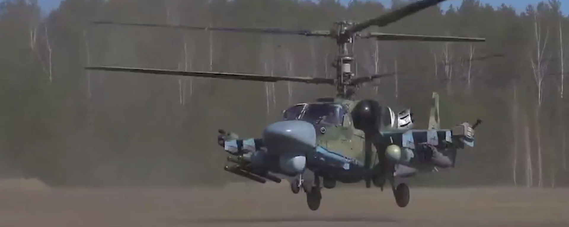 A screenshot of a video depicting a Ka-52 attack helicopter hitting Ukrainian positions. A screenshot of a video depicting a Ka-52 attack helicopter hitting Ukrainian positions. - Sputnik International, 1920, 12.06.2022