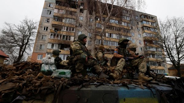 Ukrainian soldiers are pictured on their military vehicle, amid Russia's invasion on Ukraine in Bucha, in Kyiv region, Ukraine April 2, 2022. - Sputnik International