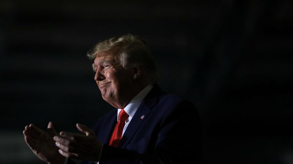 Former U.S. President Donald Trump claps as Michigan Secretary of State candidate Kristina Karamo speaks during a rally in Washington Township, Michigan, U.S. April 2, 2022. - Sputnik International