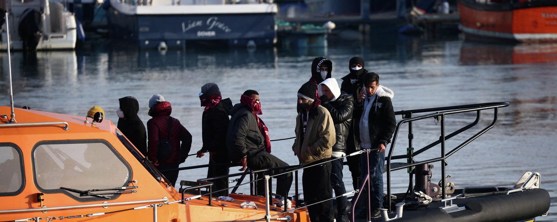 Migrants are brought into the Port of Dover after being rescued while crossing the English Channel, in Dover - Sputnik International, 1920, 15.04.2022