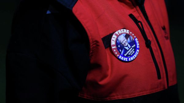 A supporter dons a pin during a rally held by former U.S. President Donald Trump in Washington Township, Michigan U.S. April 2, 2022 - Sputnik International