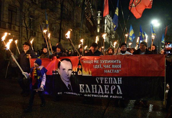 2022: Kiev. Annual torchlight procession in honour of the birth of Stepan Bandera. In Nazi Germany, torchlight processions were held on Adolf Hitler’s birthday. Text on the poster reads “Nothing will stop an idea whose time has come.” The Kremlin’s Spasskaya Tower is pictured burning in the background. - Sputnik International