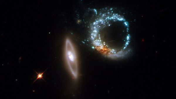 An image taken by Hubble Space telescope and released on October 30, 2008 by European Space Agency (ESA), shows a pair of gravitationally interacting galaxies called Arp 147, photographed on October 27-28, 2008. Arp 147 lies in the constellation of Cetus, more than 400 million light-years away from Earth. - Sputnik International