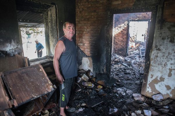 August 2015: Resident of the village of Alexandrovka, Donetsk People’s Republic stands in his wrecked home. The majority of the destruction of civilian infrastructure in the Donbass occurred between 2014 and 2015 in shelling and Ukrainian air attacks. - Sputnik International