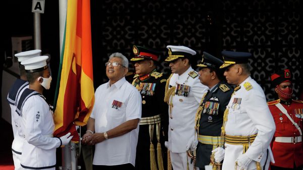 Sri Lanka's President Gotabaya Rajapaksa raises the national flag during the country's 74th Independence Day celebrations in Colombo, Sri Lanka February 4, 2022.  - Sputnik International