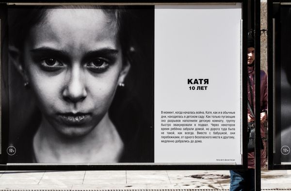 Katya, 10 years old. "The moment the hostilities broke out, Katya was in a kindergarten as she would be on normal days. As soon as the frightening echo of explosions filled the children's room, the group was swiftly evacuated to the basement. After a while, the child was taken home, but the road was not the usual one. Together with her grandmother, they ran back and forth from one safe place to another, slowly making their way home". - Sputnik International