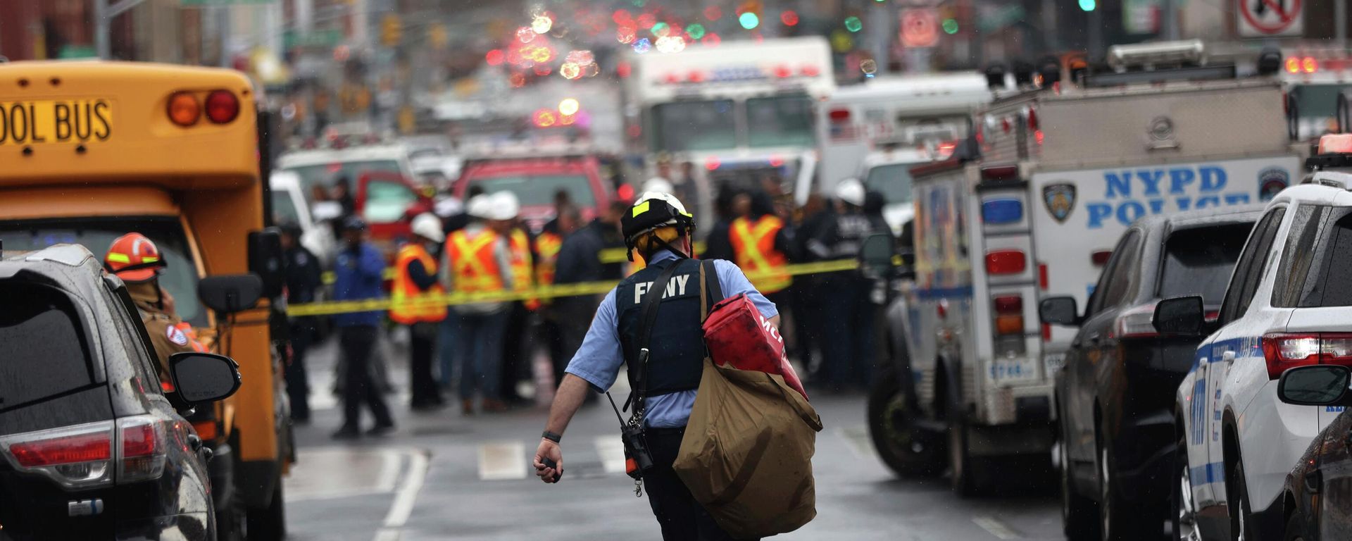 Law enforcement gather near the entrance to a subway stop in the Brooklyn borough of New York, Tuesday, April 12, 2022.   - Sputnik International, 1920, 12.04.2022