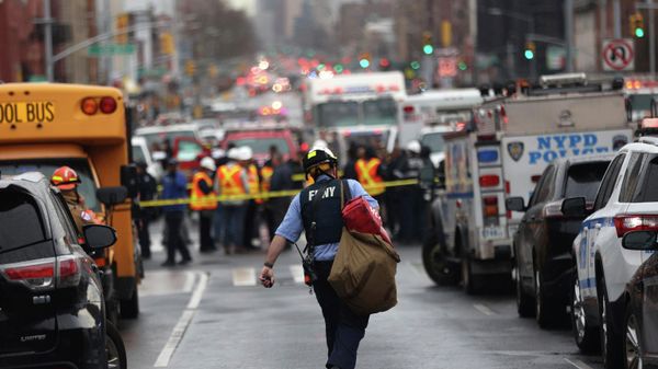 Law enforcement gather near the entrance to a subway stop in the Brooklyn borough of New York, Tuesday, April 12, 2022.   - Sputnik International