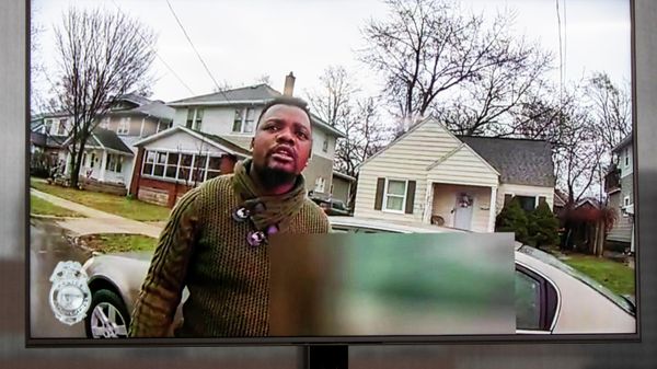 A TV display shows video evidence of a Grand Rapids police officer struggling with and shooting Patrick Lyoya at Grand Rapids City Hall on Wednesday, April 13, 2022. Lyoya, 26, was shot and killed about 8:10 a.m., on April 4, after what police said was a traffic stop. - Sputnik International