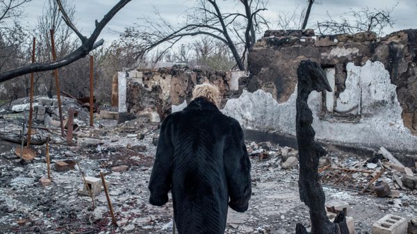 A woman near a destroyed house in the village of Sakhanka, situated in the southern Donetsk People’s Republic on the line of contact between DPR militia and Ukrainian forces. Ukrainian forces have levelled thousands of homes and apartment buildings in Donbass through artillery and air strikes over the past eight years. The people who inhabited them have been left with nothing. - Sputnik International