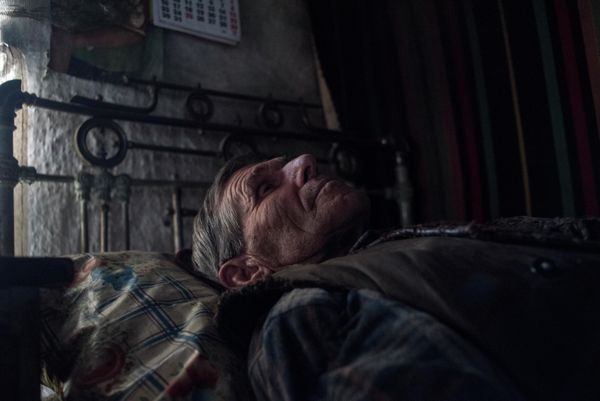 Photo shows a resident in his home in the Novoazovsk district of Donetsk. Desperation, despair, hopelessness, all of this came into the lives of the civilian population of Donbass along with shells when Kiev began its so-called “anti-terrorist operation” in the region in 2014. - Sputnik International