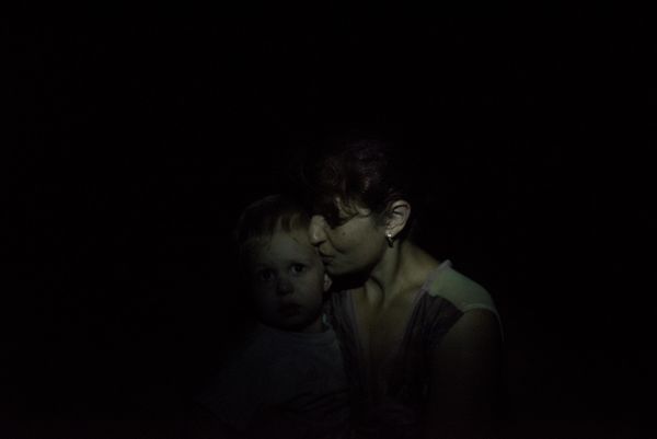 A woman and her son hide in the basement of a house in Gorlovka, 2016. The DPR city of Gorlovka has seen heavy fighting since July 2014 between local militias and the Ukrainian Army. The city has been on the line of fire throughout the war.  - Sputnik International