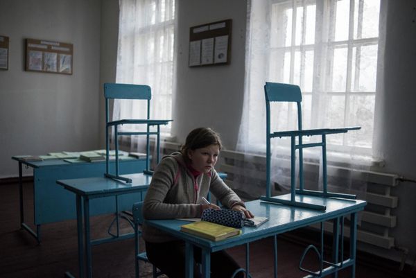 A girl at a school desk in the village of Sakhanka. Some of Donbass’ children can still recall a peaceful life, but the majority no longer know what it’s like to live when someone isn’t shooting, when they don’t have to take cover from incoming bombs and bullets. Frontline villages have been emptied. Everyone who could leave has gone, and those who remain living on their land are forced to survive as best they can. - Sputnik International