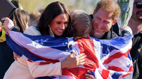 Prince Harry and Meghan Markle, Duke and Duchess of Sussex, hug Lisa Johnston, a former army medic and amputee, who celebrates with her medal at the Invictus Games venue in The Hague, Netherlands, Sunday, April 17, 2022 Prince Harry and Meghan Markle, Duke and Duchess of Sussex, hug Lisa Johnston, a former army medic and amputee, who celebrates with her medal at the Invictus Games venue in The Hague, Netherlands, Sunday, April 17, 2022 - Sputnik International