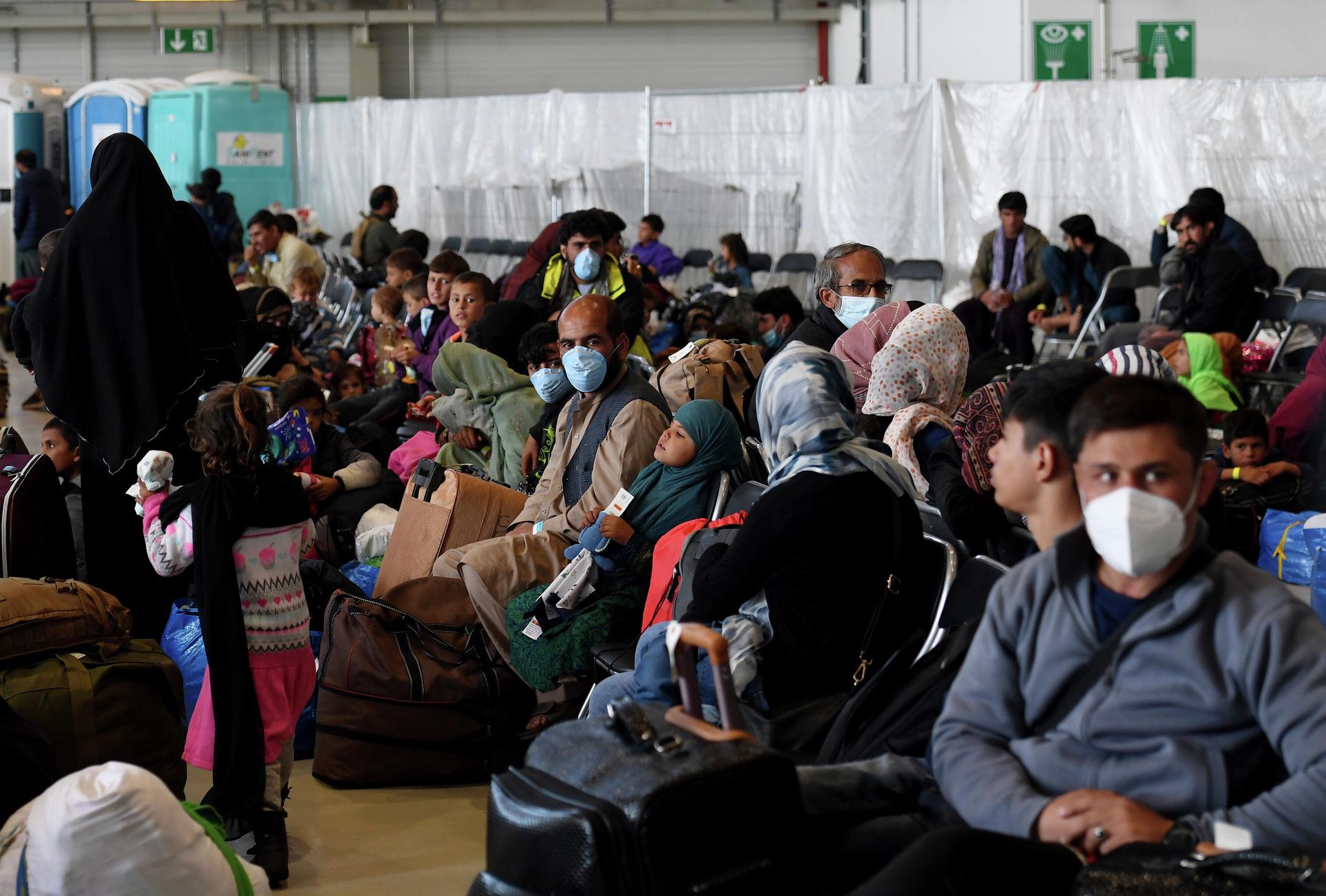 Afghan refugees are processed inside Hangar 5 at the Ramstein U.S. Air Base in Germany Wednesday, Sept. 8, 2021. U.S. Secretary of State Antony Blinken arrived at the base where he will meet with his German counterpart for talks on Afghanistan. Afghan refugees are processed inside Hangar 5 at the Ramstein U.S. Air Base in Germany Wednesday, Sept. 8, 2021. U.S. Secretary of State Antony Blinken arrived at the base where he will meet with his German counterpart for talks on Afghanistan. - Sputnik International, 1920, 04.10.2022