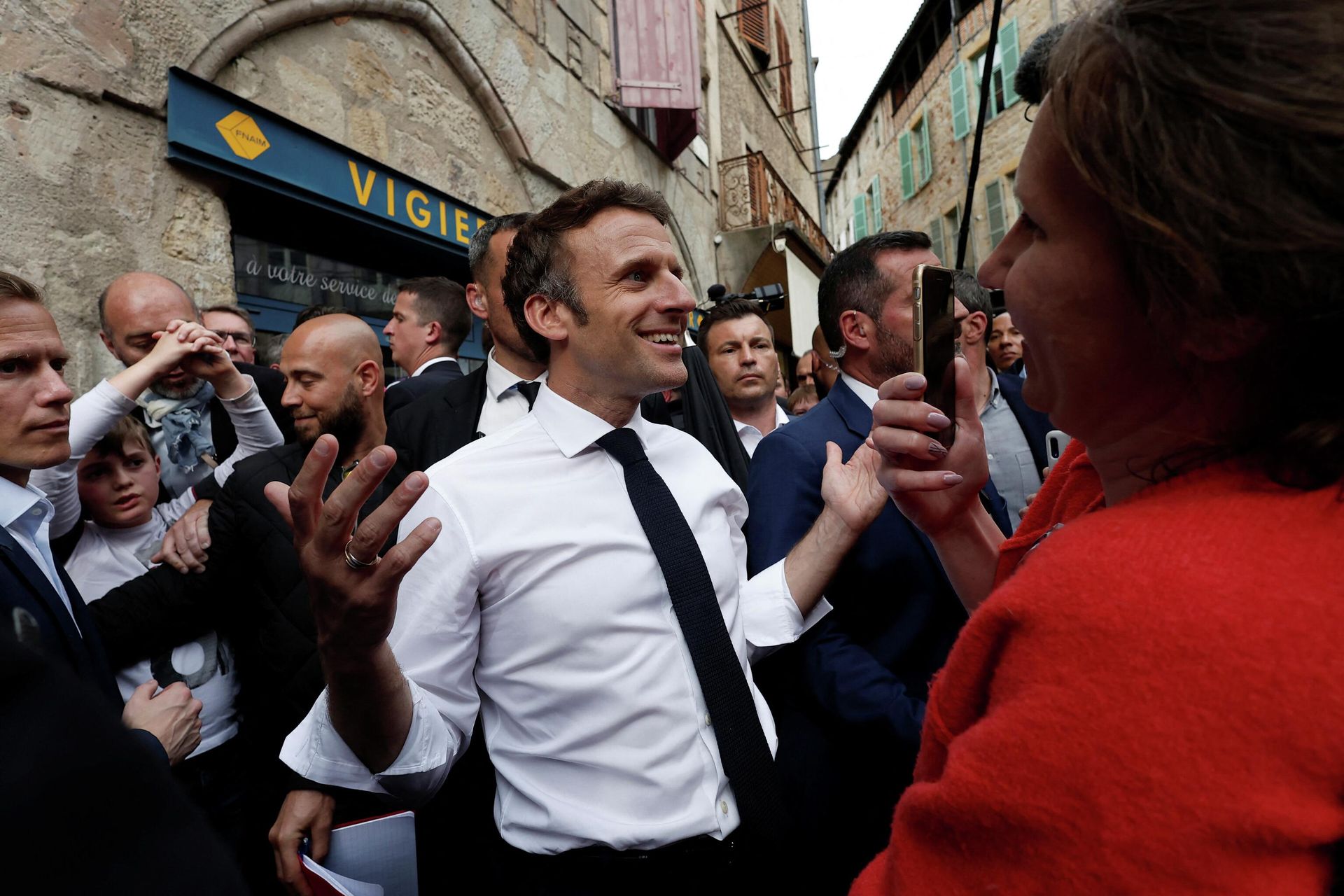 Centrist candidate and French President Emmanuel Macron reacts as he meets residents after a campaign rally Friday, April 22, 2022 in Figeac, southwestern France. Emmanuel Macron is facing off against far-right challenger Marine Le Pen in France's April 24 presidential runoff. Centrist candidate and French President Emmanuel Macron reacts as he meets residents after a campaign rally Friday, April 22, 2022 in Figeac, southwestern France. Emmanuel Macron is facing off against far-right challenger Marine Le Pen in France's April 24 presidential runoff. - Sputnik International, 1920, 24.04.2022