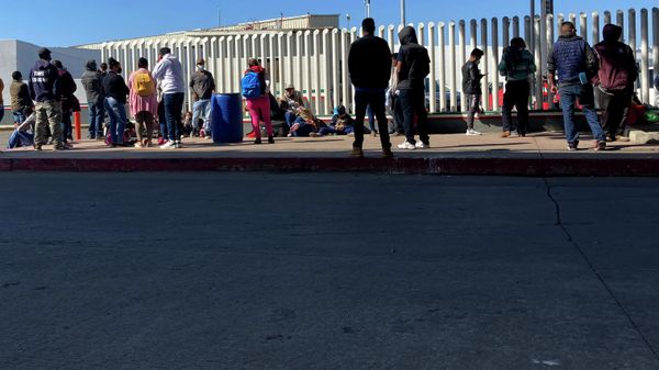 Migrants waiting to cross into the United States wait for news at the border crossing Wednesday, Feb. 17, 2021, in Tijuana, Mexico. Migrants waiting to cross into the United States wait for news at the border crossing Wednesday, Feb. 17, 2021, in Tijuana, Mexico. - Sputnik International