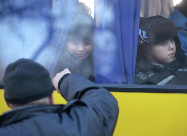 Thousands of people were forced to leave their home and be evacuated. Women and children in particular had to flee to safer regions and Russia.Photo: A father says goodbye to his son who is leaving Donetsk for Russia along with other refugees. - Sputnik International